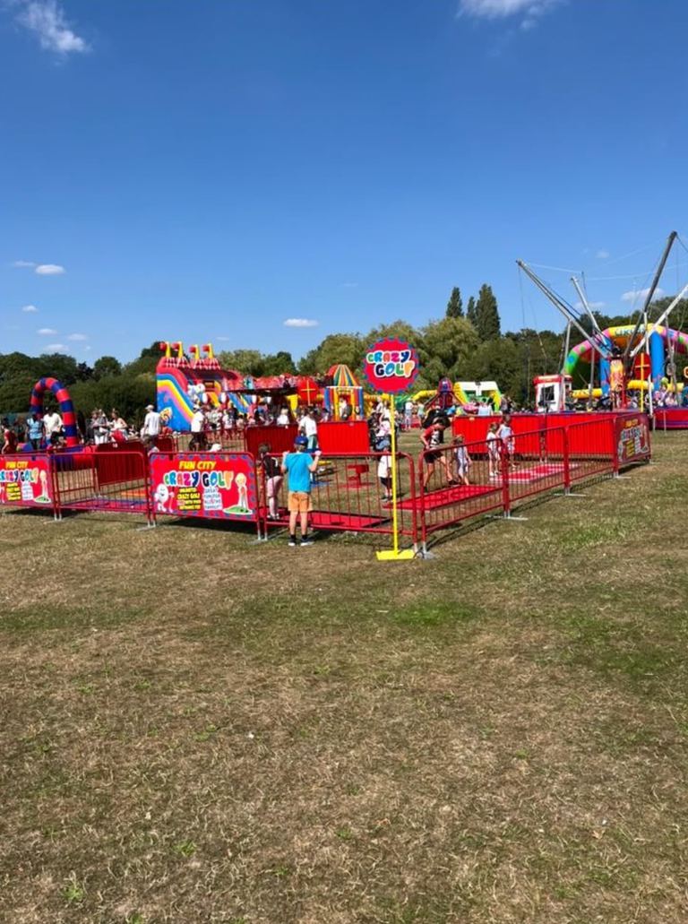 A crazy golf course set up at an outdoor fun day