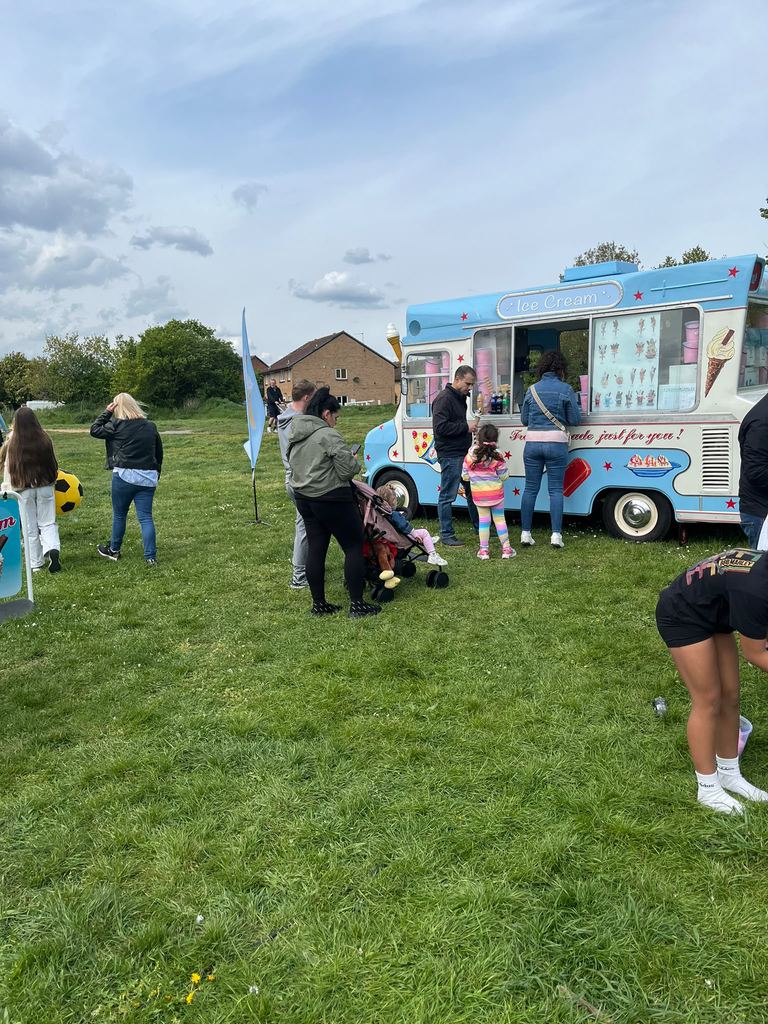 A traditional ice cream van serving customers outdoors