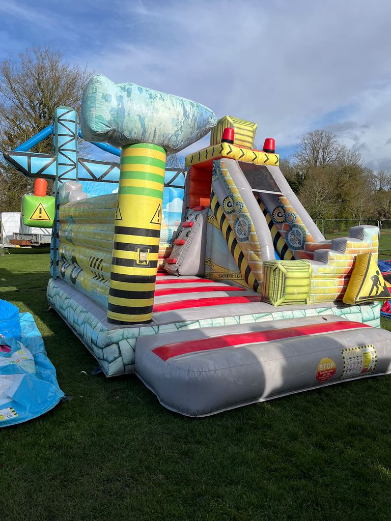 A construction-themed inflatable slide and obstacle course