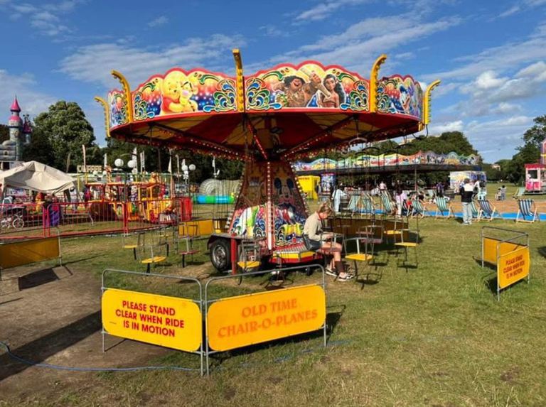A vintage-style chairoplane ride with hanging seats