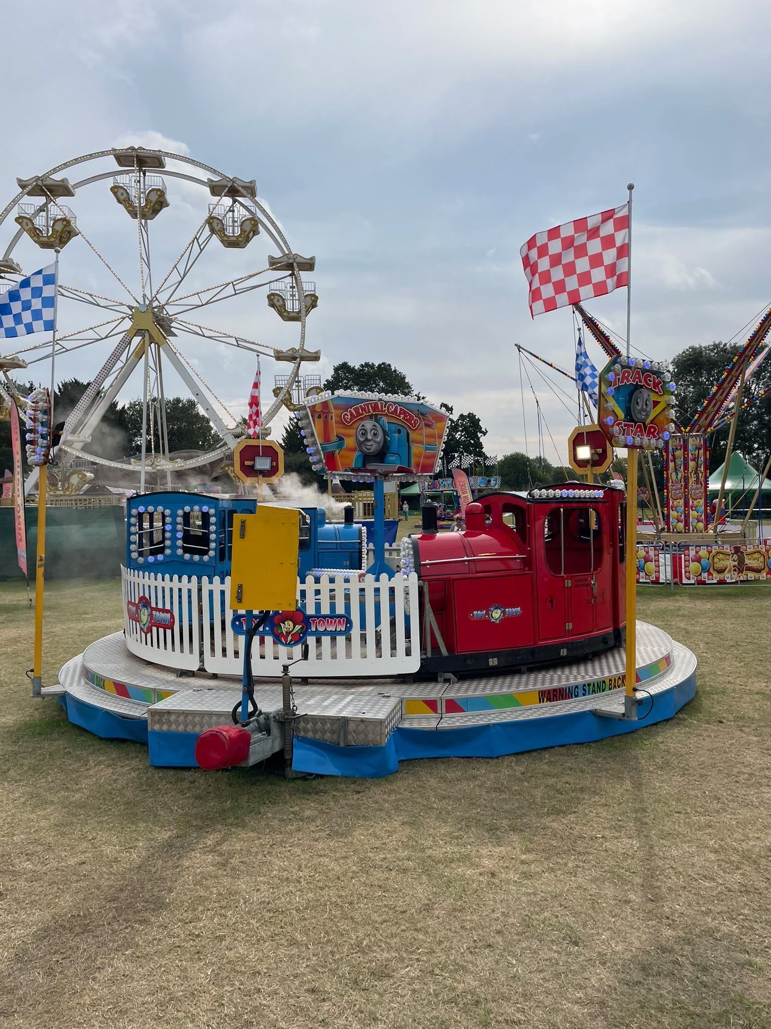 A colourful kids' Toy Town train ride with a Thomas-style red and blue engine